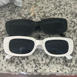 (2) Black and white sunglasses